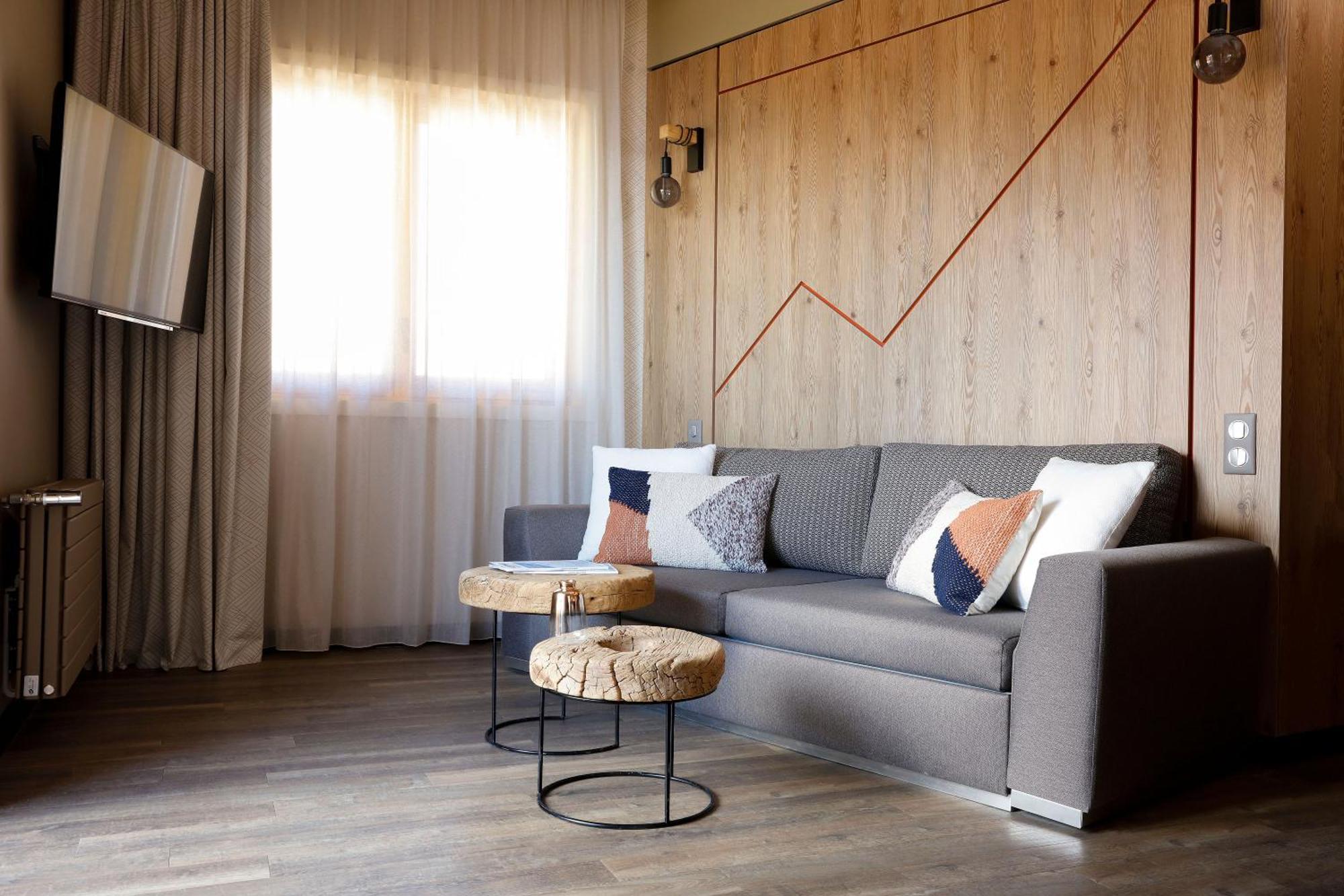 Grandes Rousses Hotel & Spa Alpe d'Huez Exterior foto A living room in a hotel